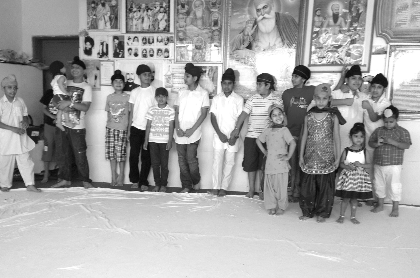 Sikh children enthusiastically attending Sunday Gurdwara function, Greece